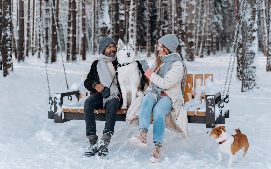 couple enjoying the snow on a swing